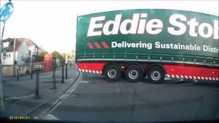 Eddie Stobart lorry doing a U-turn on a mini roundabout