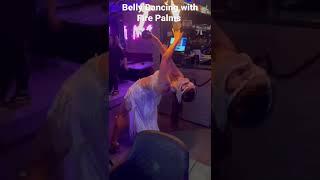 Sarasvati Dance belly dance performance with fire palms in London