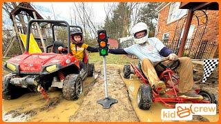 Mud racing kids ride on truck vs. dad's go-kart through mud, jump, and woods. Educational | Kid Crew