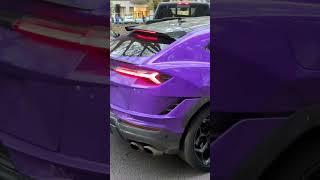 German soccer player Jeremie Frimpong in his purple Lamborghini Urus in Königsallee In Düsseldorf