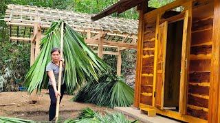 Build a kitchen with wood and roof it with natural grass leaves