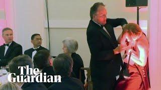 Conservative MP Mark Field grabs climate protester by the neck