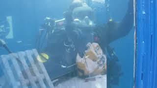 Female Commercial Diver is Diving with Viking Rubber Drysuit and Interspiro Full Face Mask in Pool