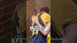 Reggie hugs an emotional T.J. McConnell