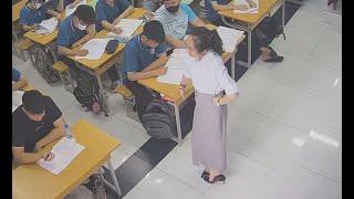 The teacher in highheels great dangling and drop under the table