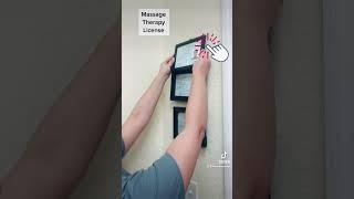 Giselle hangs massage license for all to see!