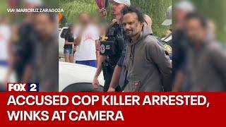 Accused cop killer WINKS, arrested with killed officer's cuffs