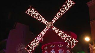 Paris's Moulin Rouge inaugurates new windmill sails in style | AFP