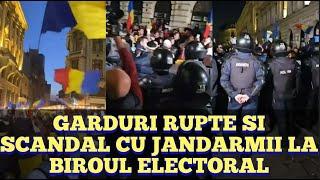 Garduri rupte, scandal cu jandarmii la Biroul Electoral Central dupa eliminarea lui Calin Georgescu