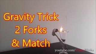 Balancing two forks on a toothpick or match