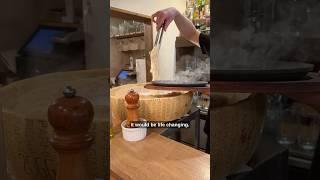 Eating pasta out of a cheese wheel in Japan