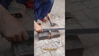 Hammer and axe work together to efficiently split steel bars