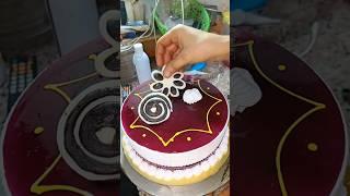 Watch while decorating a blueberry cake