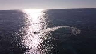 West Bay Beach Roatan Honduras: 4K Drone of Crystal Clear Caribbean Water & Tropical Paradise
