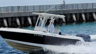 Robalo Center Console Pounds Up The Boynton Beach Inlet.