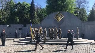 Ceremony of giving Ukrainian flag to wifes of Ukrainian soldiers during funeral at the Lviv Lychakiv