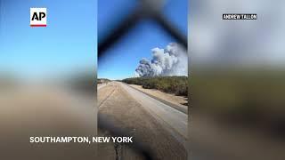 Cellphone footage captures active brush fire on New York's Long Island shooting smoke into the sky