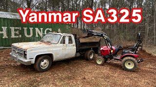 Yanmar SA325 with grapple, front end loader, and bucket clearing my property. Chevy R30 dump truck.