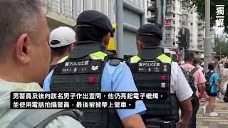 【六四36】黑衣男於維園持電子蠟燭悼念  被帶上警車
