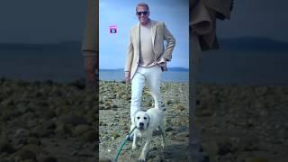  Kevin Costner and his white Labrador.