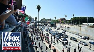 FREEWAY TAKEOVER: Los Angeles rioters take to major highway