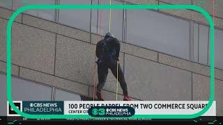 100 people rappel from from Two Commerce Square in Center City for a good cause