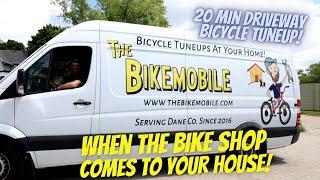 Bicycle service van tunes up a bicycle in a driveway!