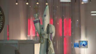 Local woodcarver hopes pieces on display at Military Circle Mall can lead to education