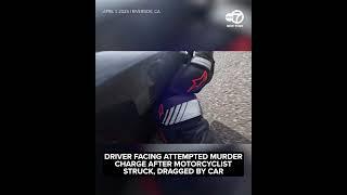 Motorcyclist dragged by car in violent road rage incident caught on video