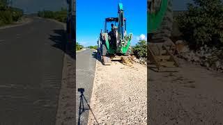 loading a backhoe onto a trailer check channel for full video #shorts