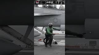 Aircraft carrier crew sending takeoff sign