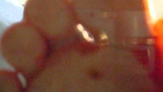 POV barefoot tomato crushing on the glass floor / Tomate auf der Glasplatte zertreten