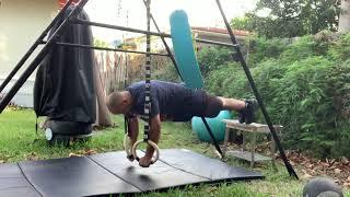 Doing inclined push-ups using gymnastic rings￼