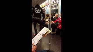 Pole dancing in New York City subway