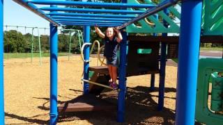 My little girl rocks the monkey bars.