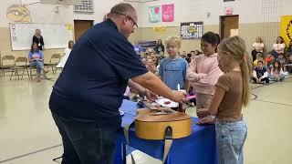 Board of Education President Craig Van Beek sings at Blue Star Respect Assembly