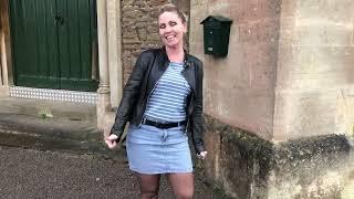 Checking out filming locations in denim skirt, knee high boots and Wolford black tights