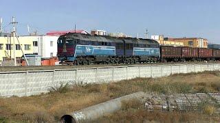 Compilation of freight trains in Mongolia rushing at high speed within the city of Ulaanbaatar