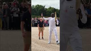 Steve Toussaint lighting up the path with the Olympic Torch in Versailles #paris2024