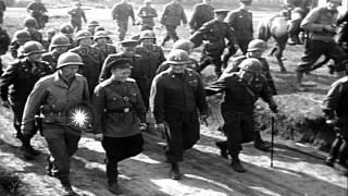 American and Russian troops march on road displaying US, Russian, and British fla...HD Stock Footage