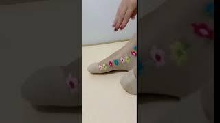 Beautiful nylon feet and nylon socks sewn with flowers