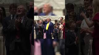 Trump salutes raising of flags on the White House front lawn