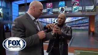 Mike Tyson gives Brian Urlacher boxing lessons