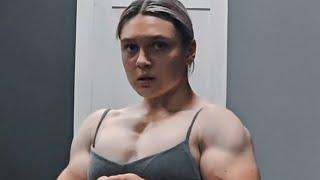 Beautiful muscular woman flexing muscles