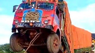 FIAT-682 old Truck overloaded he raised his head Men use ropes to try and right a supply truck load