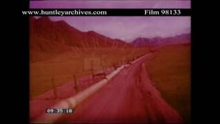 Oil pipeline under construction in Alaska in the 1970's.  Archive film 98133