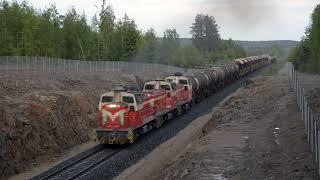 Freight train climbs hill at Aittojärvi Finland.