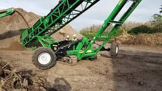 McCloskey R230 screening soil into New 80' All Terrain Radial Lift Axle Track Stacker