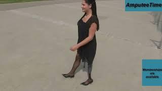 Amputee woman Natalie walking with crutches and prosthetic leg