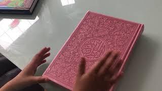 The pink covering and rainbow paged Quran